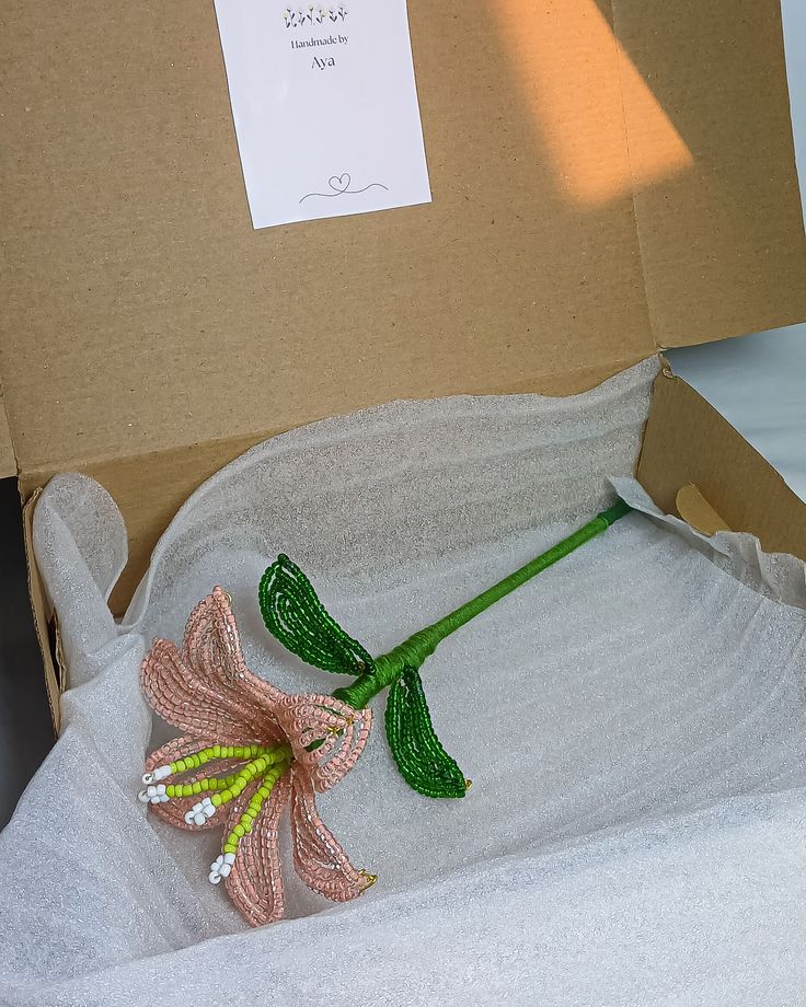 Hand-beaded lily packed for delivery